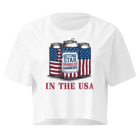 White t-shirt with graphic of beer cans and text 'Getting Star Spangled Hammered in the USA' on a white background