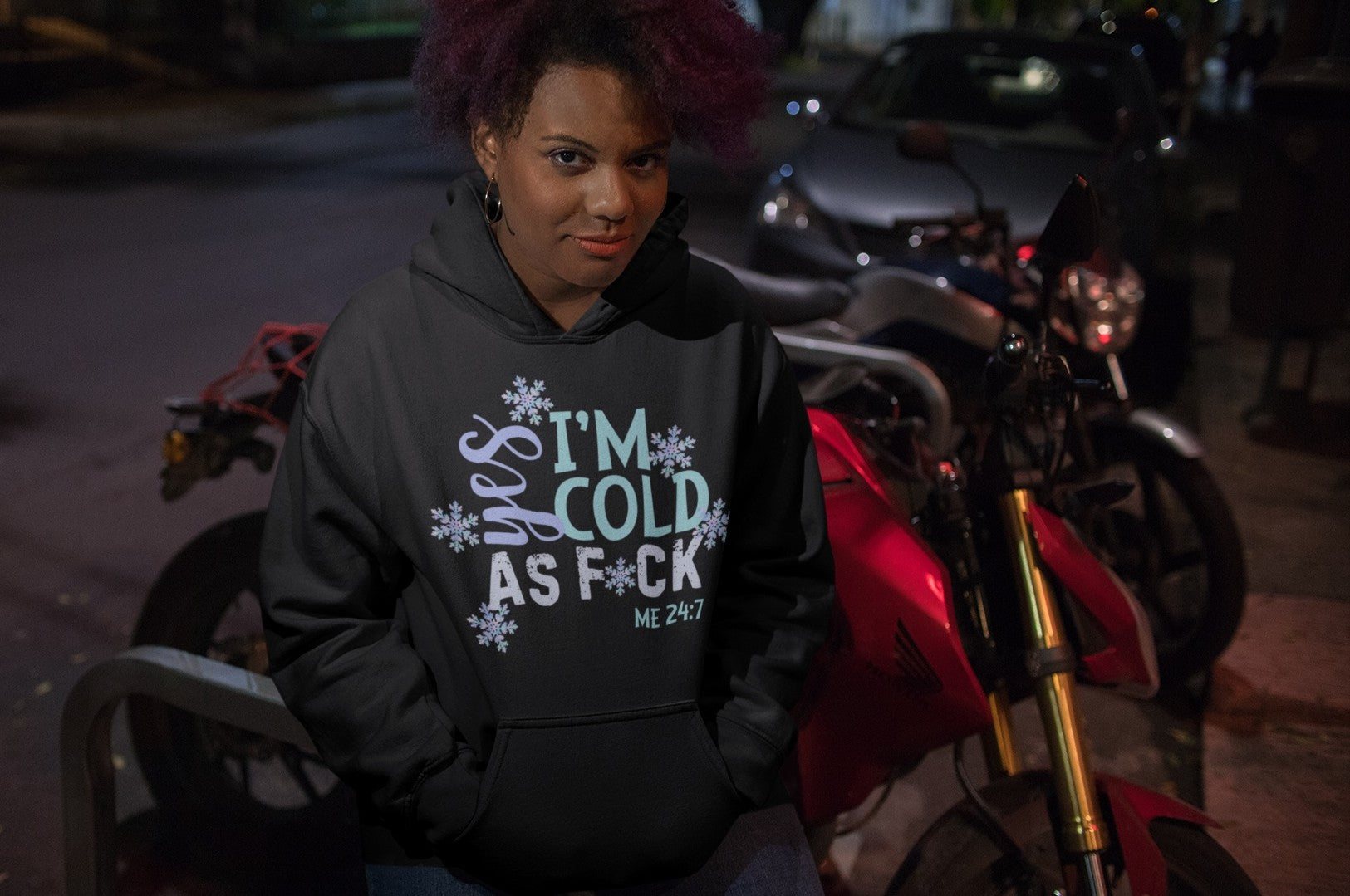 Women’s funny hoodie – black pullover with snowflakes and bold text saying Yes I’m Cold As F*ck, casual winter streetwear by Infidel Collective.