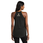 A woman shown from the back wearing a black sleeveless athletic tank top with a small gold and white graphic logo on the upper back, paired with black leggings, against a plain white background.