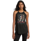 A woman modeling a black halter-neck tank top with a patriotic graphic on the front. The graphic features a stylized portrait of a woman wearing an American flag headscarf, a distressed American flag background, and the text 'MAKE AMERICA USA' in red, white, and blue.
