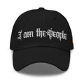 Black low-profile dad hat with embroidered I Am the People front design, front view