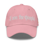 Pink low-profile dad hat with embroidered I Am the People front design, front view