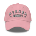 Pink low-profile dad hat with embroidered Diesel Cowboy front design, front view