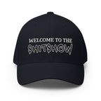 Black cap with 'WELCOME TO THE SHITSHOW' text on a white background