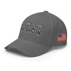 Left-front view of grey Welcome to the Shitshow Flexfit hat