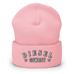"Diesel Cowboy" embroidered into this cuffed beanie hat by Infidel Collective, available in 12 colors, shown here in pink.