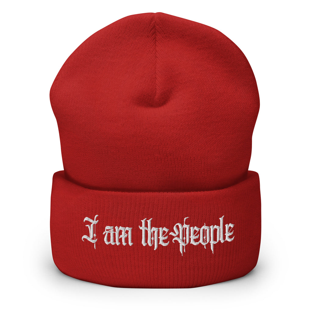 Red cuffed knit beanie with embroidered I Am the People front design, front view