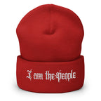 Red cuffed knit beanie with embroidered I Am the People front design, front view