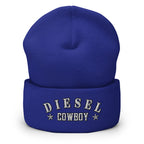 "Diesel Cowboy" embroidered into this cuffed beanie hat by Infidel Collective, available in 12 colors, shown here in royal blue.