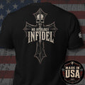 Black short-sleeve t-shirt shown from the back with a large distressed cross graphic featuring a skull and the words 'NO APOLOGY INFIDEL'. The shirt is photographed against a rustic American flag backdrop, with a circular 'Made in USA 100% American Made' badge in the lower right corner.