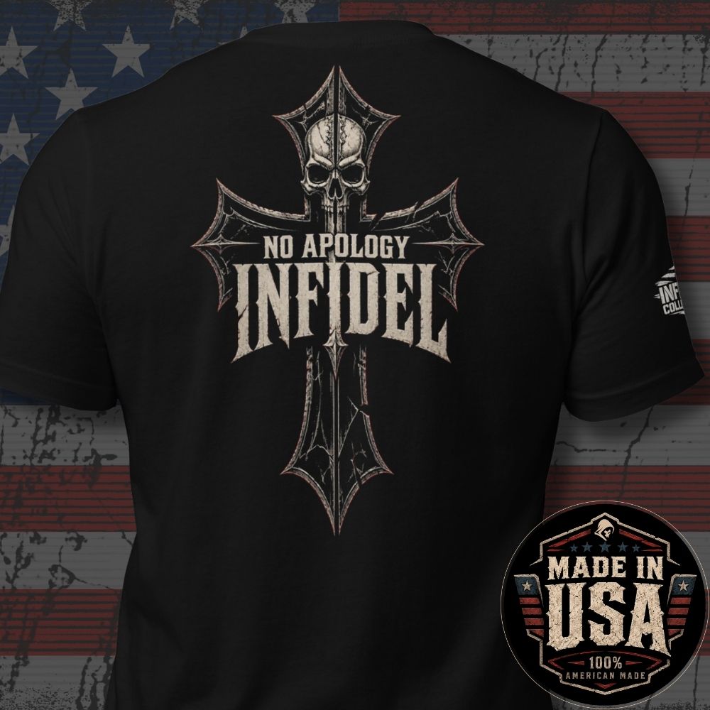 Black short-sleeve t-shirt shown from the back with a large distressed cross graphic featuring a skull and the words 'NO APOLOGY INFIDEL'. The shirt is photographed against a rustic American flag backdrop, with a circular 'Made in USA 100% American Made' badge in the lower right corner.