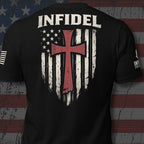 Black short-sleeve t-shirt shown from the back, featuring a distressed white American flag graphic with a crimson red cross in the center, the word 'INFIDEL' printed across the upper back. The left sleeve has an American USA flag and the right sleeve the brand logo for INFIDEL COLLECTIVE.