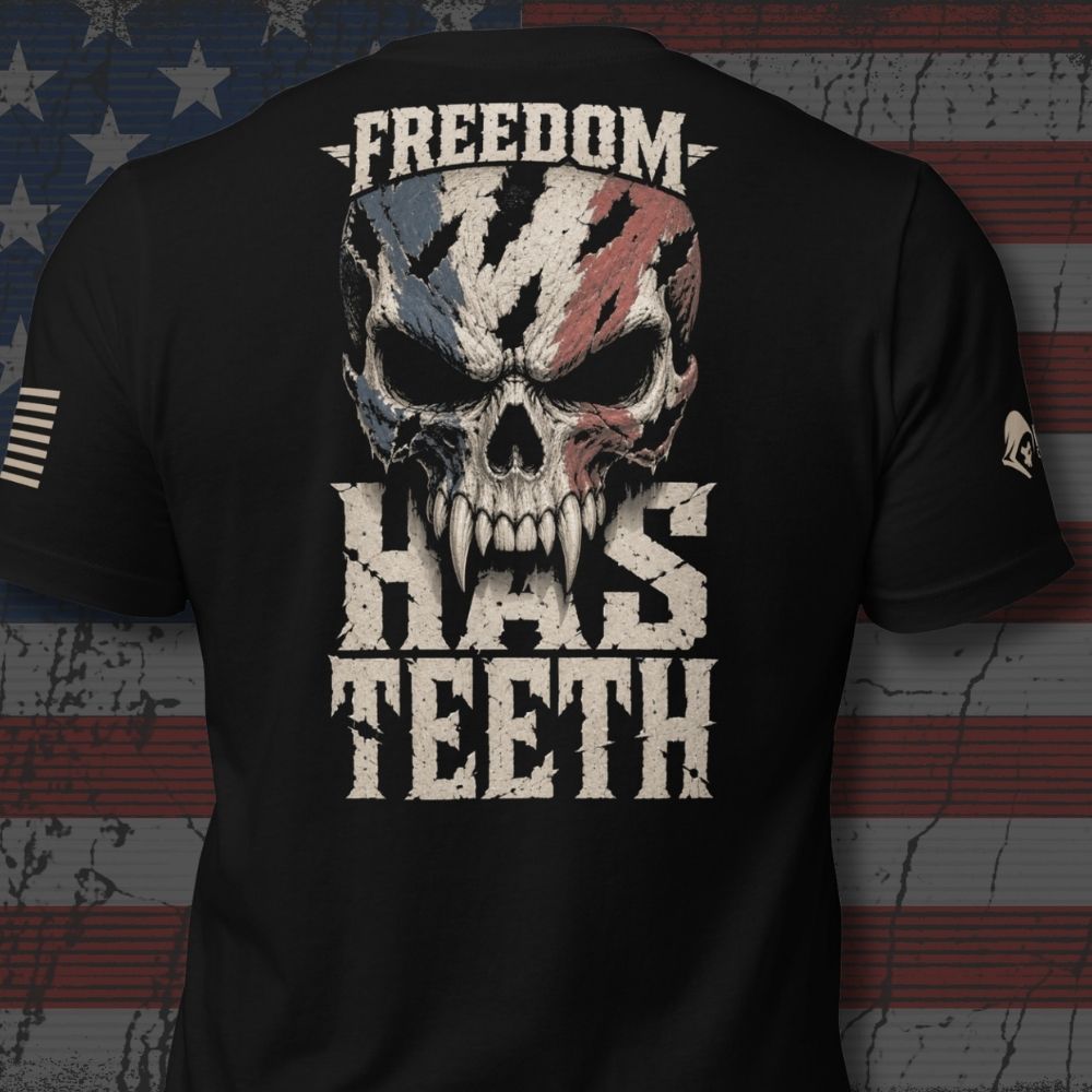 Infidel Collective black tee with American flag skull and “FREEDOM HAS TEETH” back print