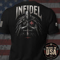 Black short-sleeve graphic T-shirt shown from the back, featuring a large knight in chainmail with a red cross emblem and the word 'INFIDEL' in white above. The shirt is photographed against a distressed American flag background, with a circular 'Made in USA 100% American Made' badge in the lower right corner.