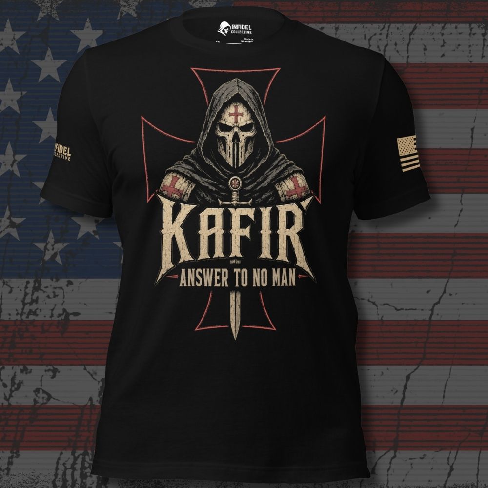 A black short-sleeve graphic T-shirt displayed against a distressed American flag background. The shirt features a large front print of a hooded warrior with a red cross on the forehead, a sword, and the text 'KAFIR' and 'ANSWER TO NO MAN.