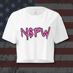 White crop top with pink text in graffiti font that says "NSFW"