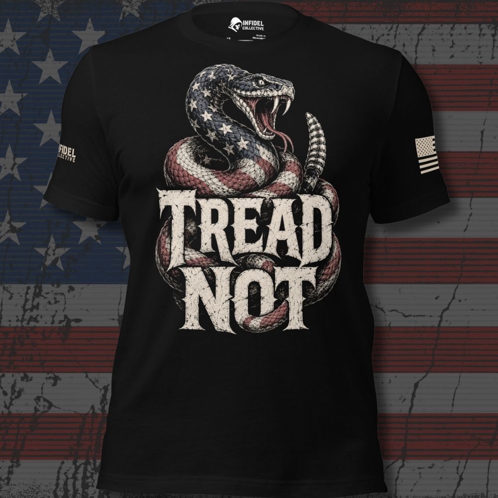 Black short-sleeve graphic T-shirt with a large coiled snake in an American flag pattern and the words 'TREAD NOT' in distressed white lettering. The shirt is shown against a faded American flag background, with a visible INFIDEL COLLECTIVE brand mark on the neck label and sleeve.