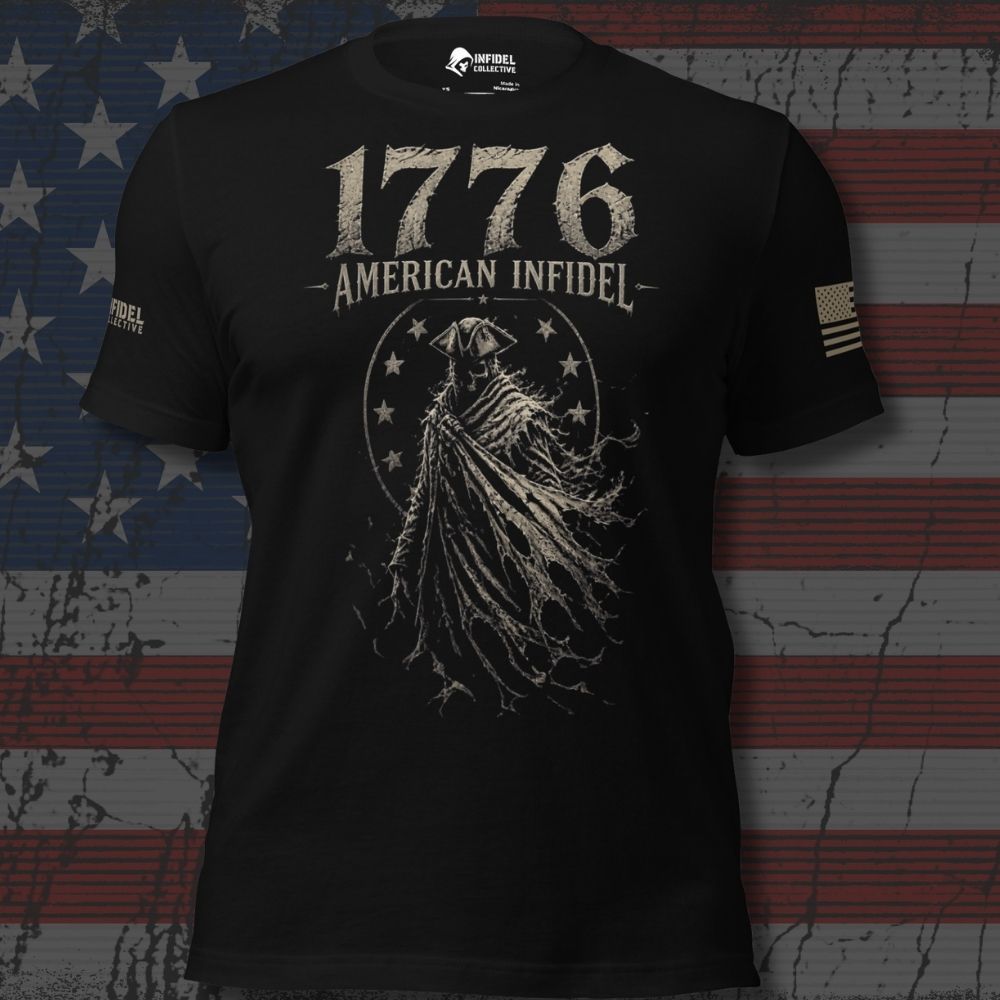 A black short-sleeve graphic T-shirt with distressed white text reading '1776 AMERICAN INFIDEL' and a large hooded figure graphic on the front. The shirt has a small logo on the neck and a small flag graphic on the sleeve, shown against a dark American flag background.