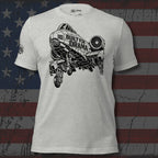 Gray t-shirt with black graphic design and 'Built for Drama' text on an American flag background