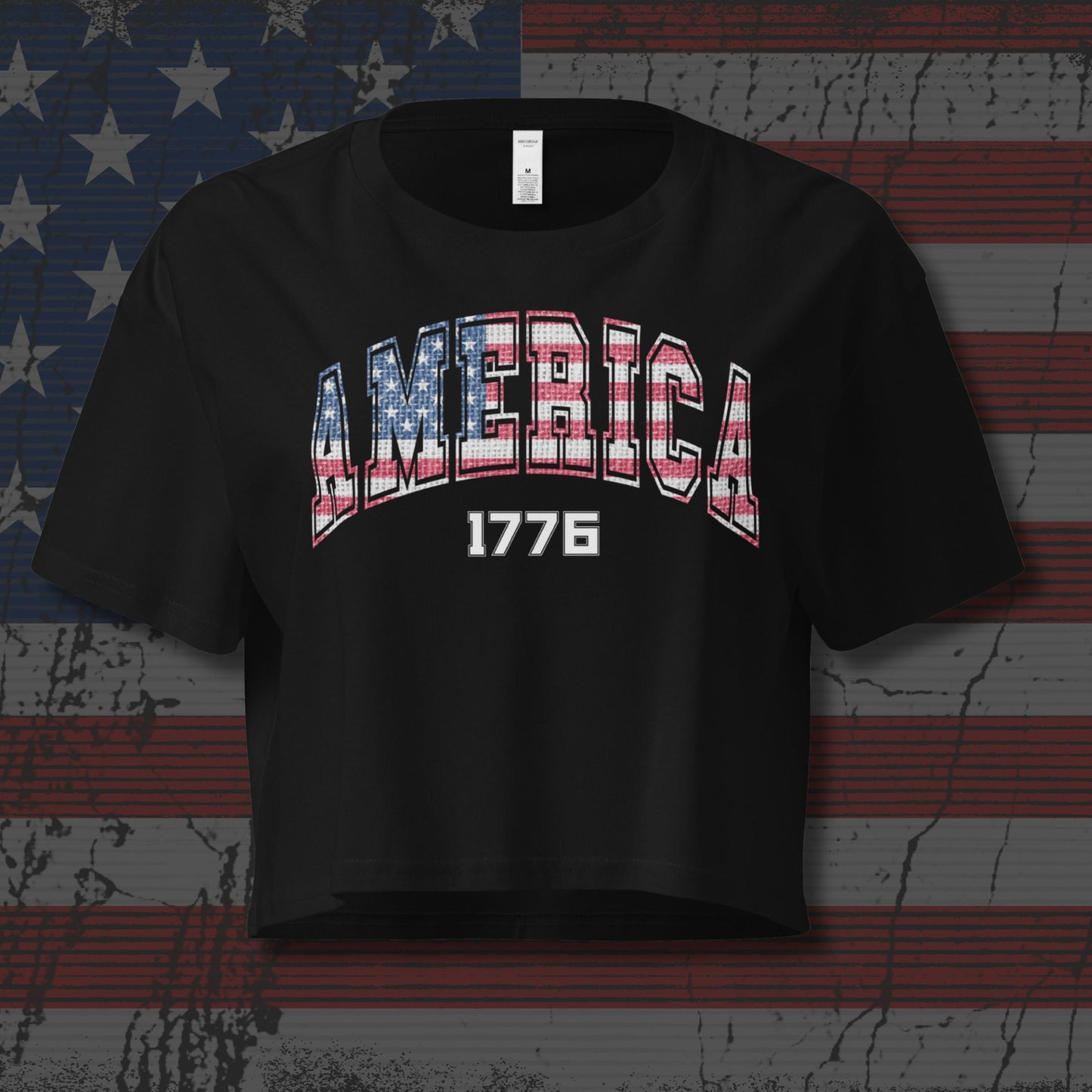 Black t-shirt with 'AMERICA 1776' design on a distressed American flag background