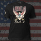 Black t-shirt with an eagle graphic and 'American Badass' text on a distressed American flag background.