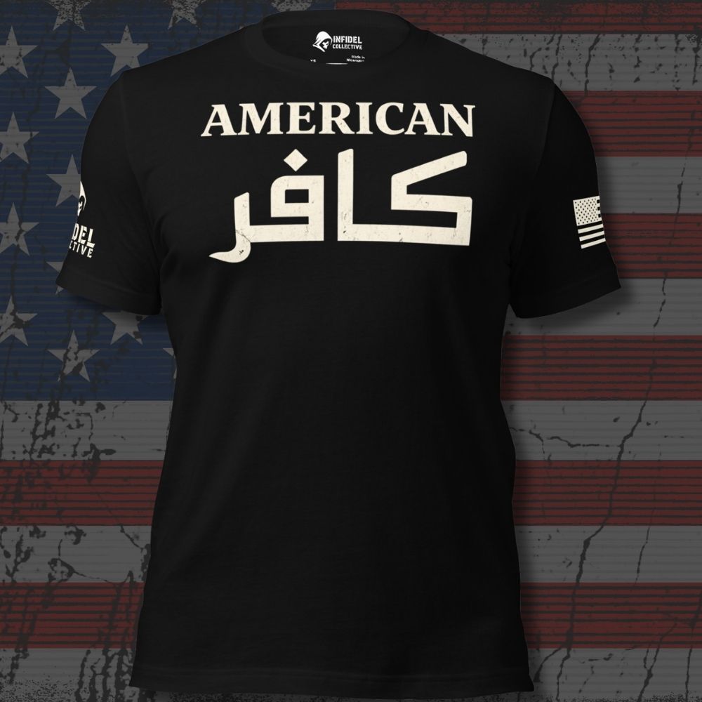 A black short-sleeve t-shirt with 'AMERICAN' in English and Arabic calligraphy KAFIR in white across the chest, displayed against a distressed American flag background.