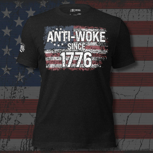 Black t-shirt with 'ANTI-WOKE SINCE 1776' text and American flag design on a distressed American flag background.