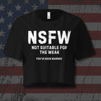 Black crop top with the text 'NSFW Not Suitable for the week You've been warned" on distressed American flag as background