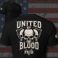 three skulls with United by Blood Paid text and patriotic stars back print black tee from Infidel Collective