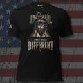 This Woman Was Built Different Liberty Bell and raised fist design front print black tee from Infidel Collective
