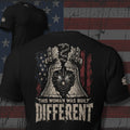 This Woman Was Built Different Liberty Bell, raised fist, and flag design back print black tee from Infidel Collective