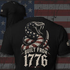 Black tee with back print featuring a patriotic rattlesnake with American flag pattern and the text Built From 1776