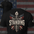 Built to Stay Standing raised fist, flag wings, and blade design back print black tee from Infidel Collective