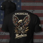 Black t-shirt with an eagle graphic and 'American Badass' text on a distressed American flag background