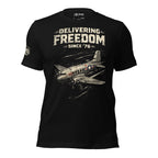 Black t-shirt with airplane graphic and 'Delivering Freedom Since '76' text on a white background