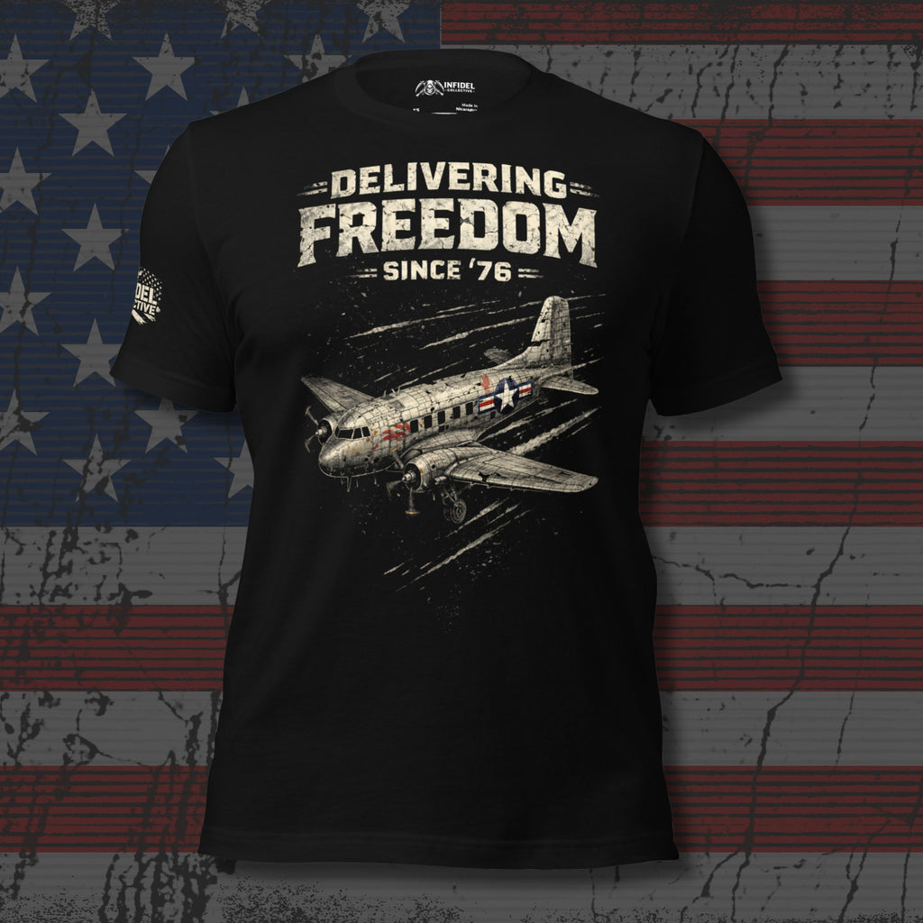 Black t-shirt with airplane graphic and text 'Delivering Freedom Since '76' on an American flag background