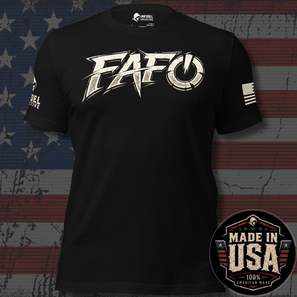 A black short-sleeve graphic t-shirt featuring a large distressed white 'FAFO' logo across the chest, with a small American flag print on the right sleeve and partial text on the left sleeve. The shirt is displayed against a rustic American flag background with a 'Made in USA' badge overlay in the bottom right corner.
