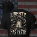 American flag rattlesnake coiled around the Liberty Bell with Liberty Has Teeth text back print black tee from Infidel Collective
