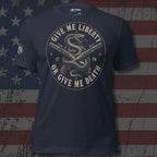 Heather navy tee with front print featuring a rattlesnake wrapped around crossed flintlock pistols and the text Give Me Liberty or Give Me Death 1776