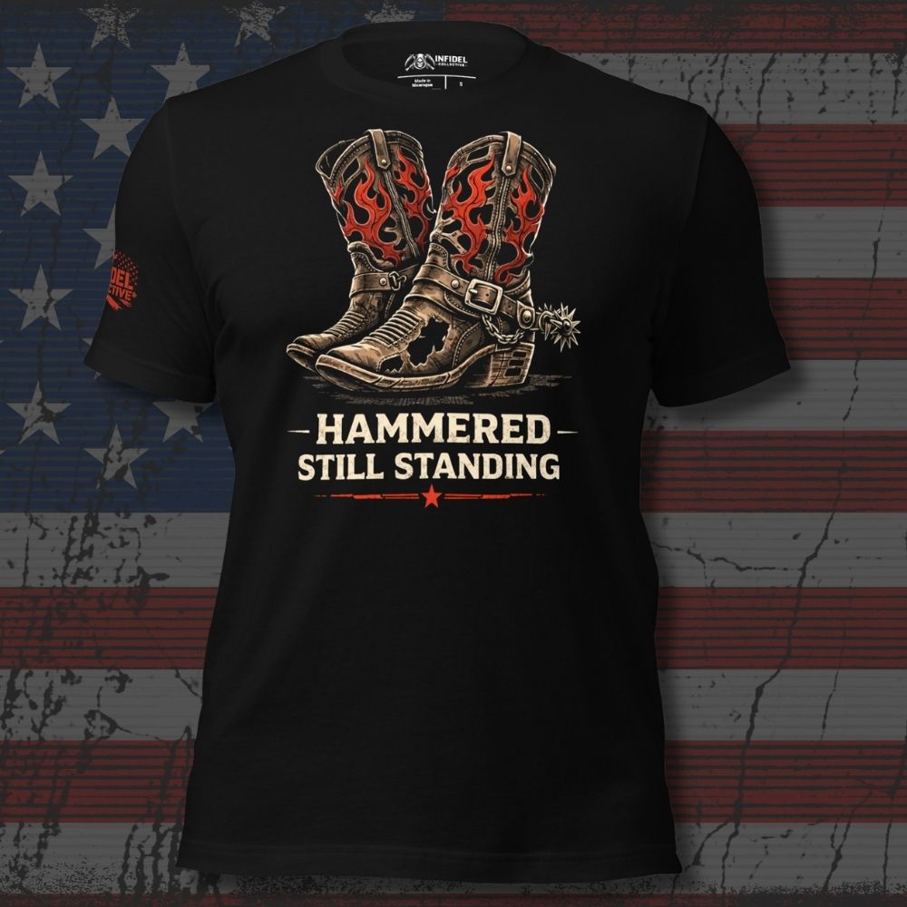 Hammered Still Standing graphic front print tee with distressed flame cowboy boots on black shirt