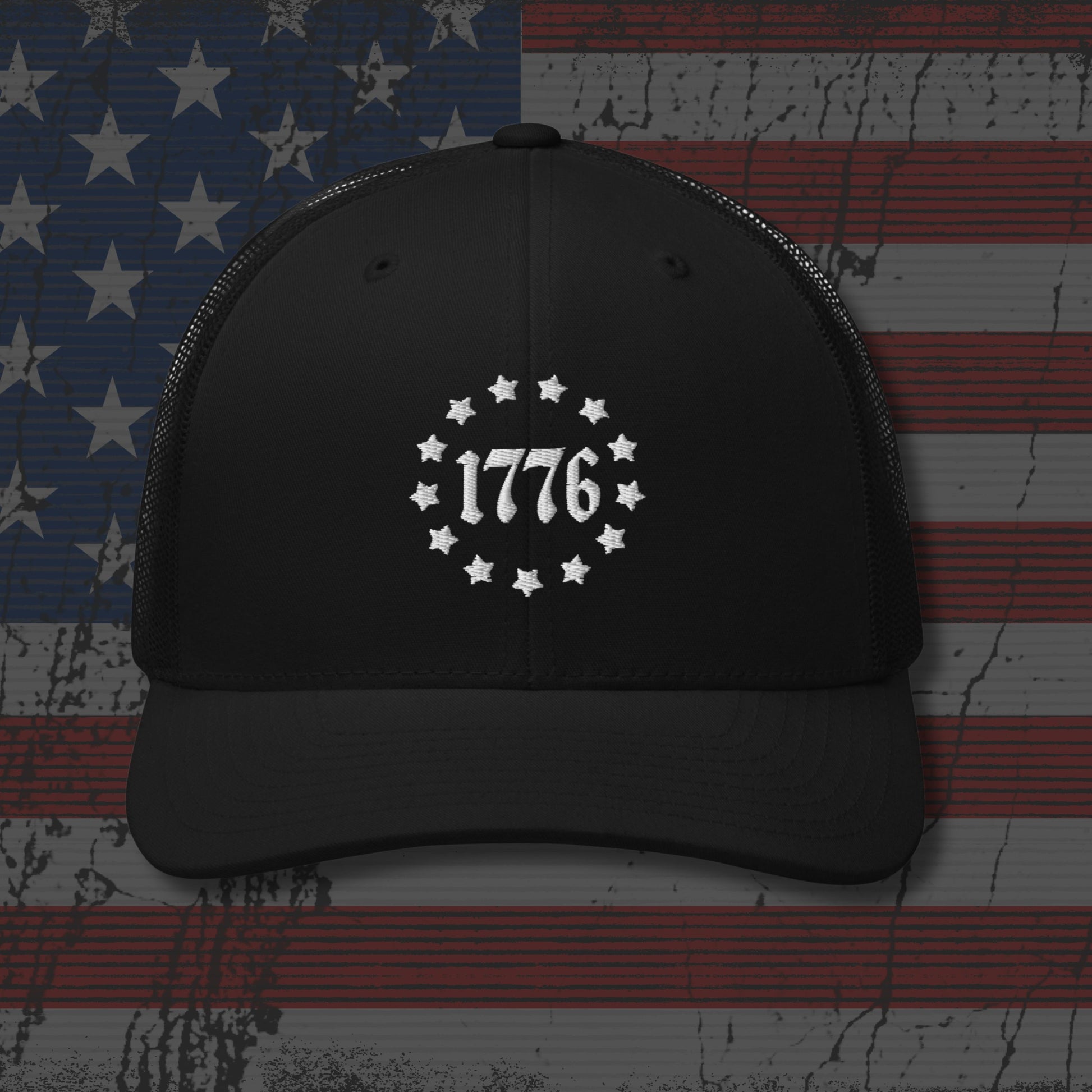 Black cap with '1776' design on an American flag background