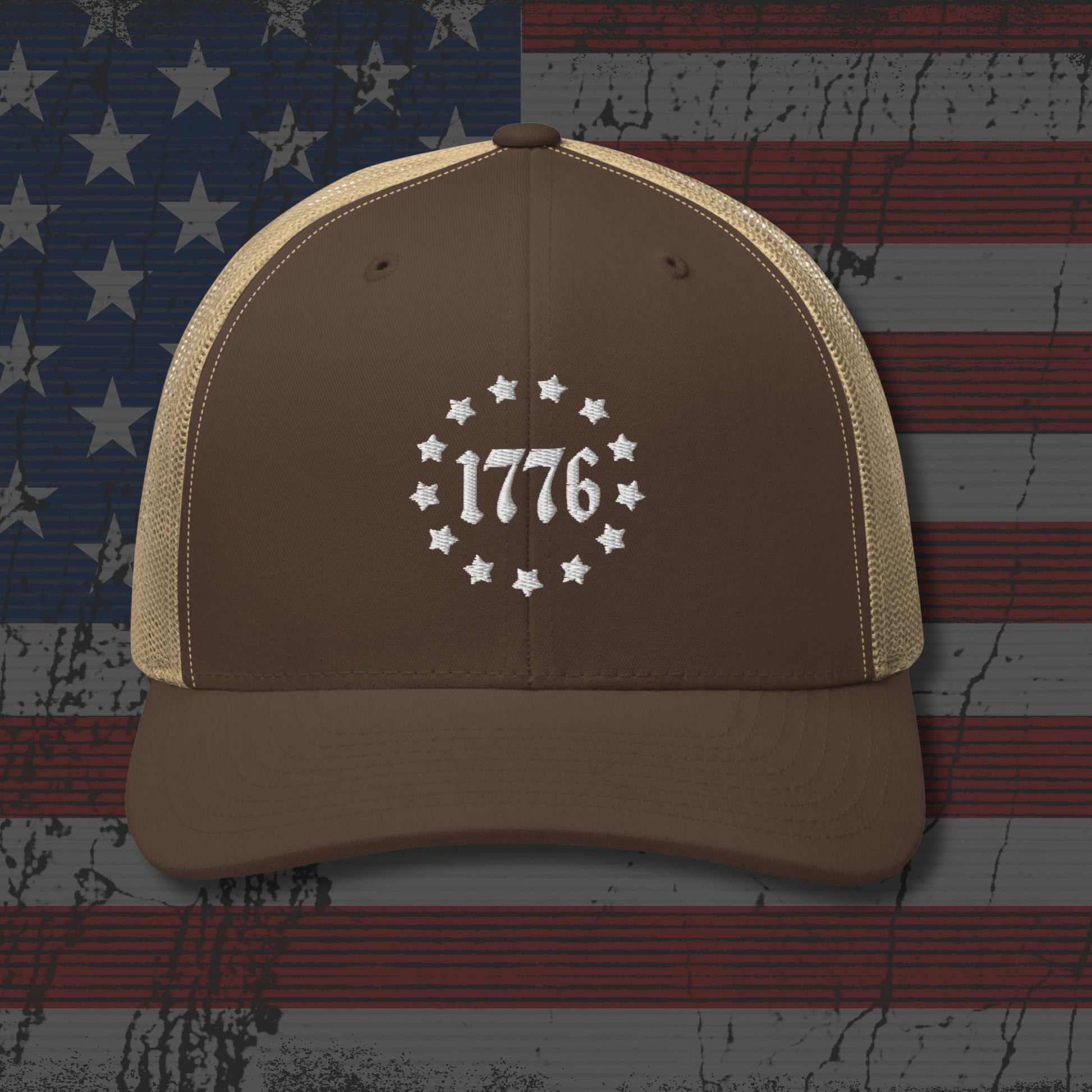Brown and beige cap with '1776' design on a distressed American flag background