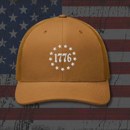Yellow cap with '1776' design on an American flag background