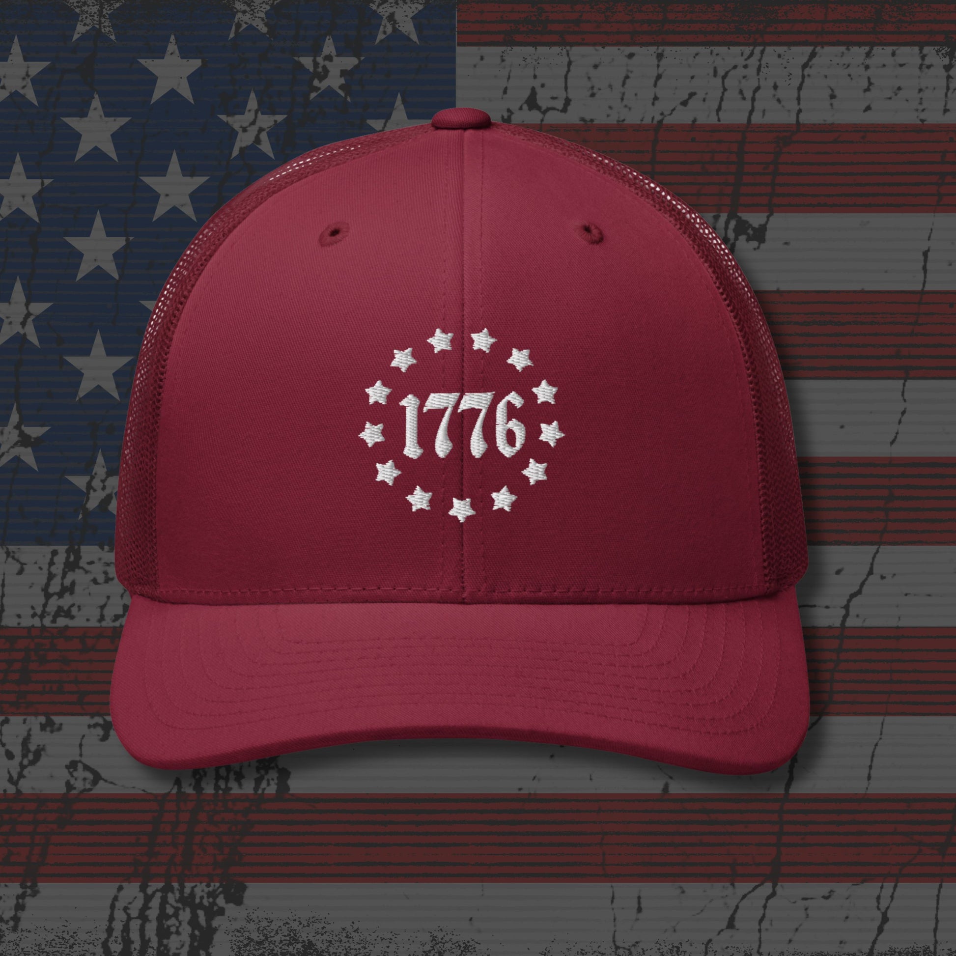 Red cap with '1776' design on an American flag background