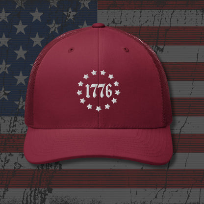 Red cap with '1776' design on an American flag background