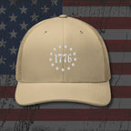 Beige cap with '1776' design on an American flag background