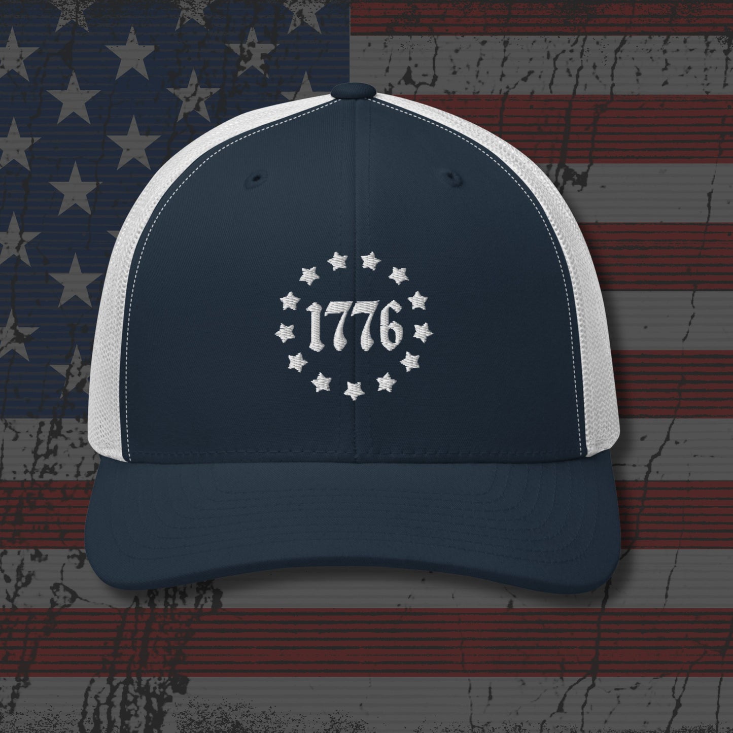 Navy and white cap with '1776' design on an American flag background