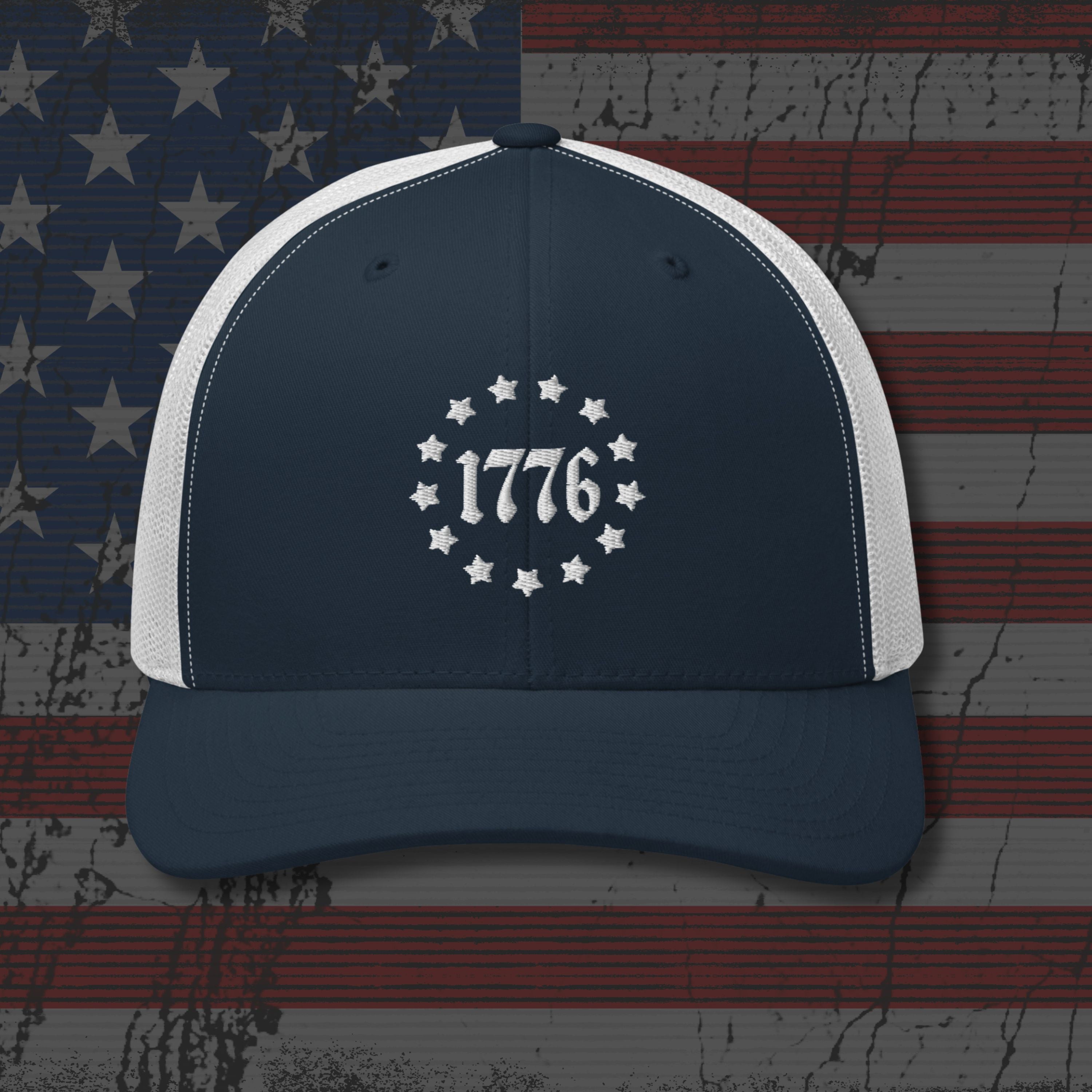 Navy and white cap with '1776' design on an American flag background