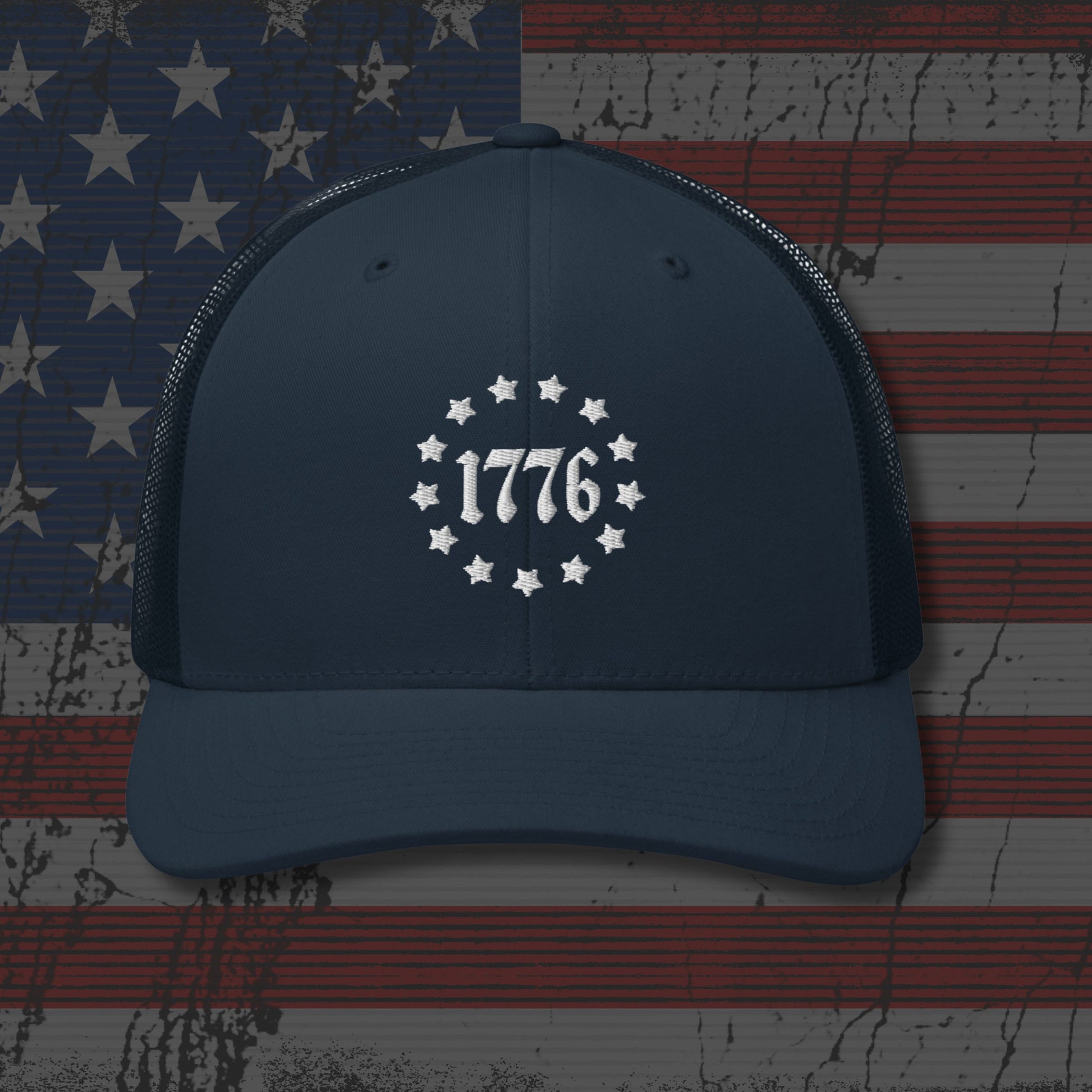 Navy blue cap with '1776' design on an American flag background
