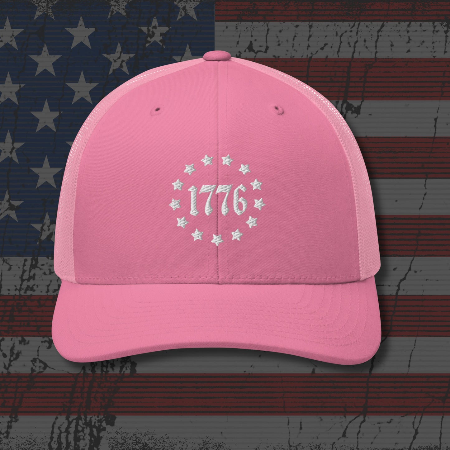 Pink cap with '1776' design on an American flag background